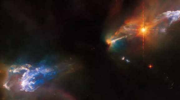 Dos impresionantes estrellas lanzan chorros de gas con los colores del arcoíris